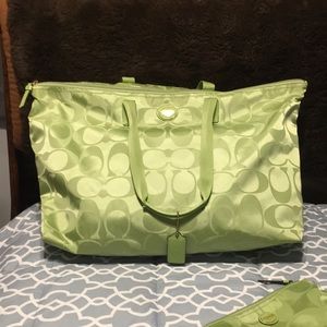 Authentic Coach Weekend Bag with matching make up bag.